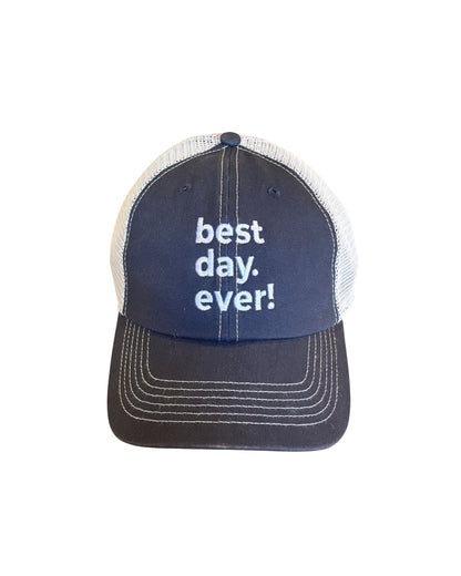 Navy blue cap with 'best day. ever!' text on a white background